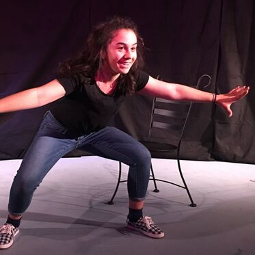 A student performs an energetic monologue. 